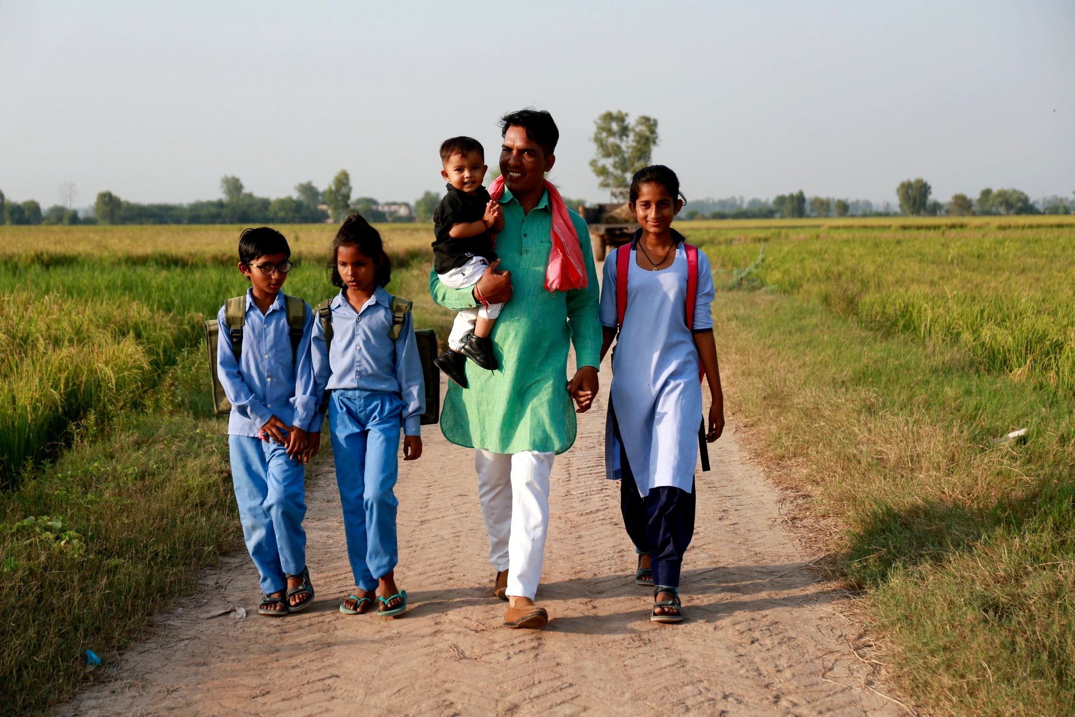Residents walking together in a rural community setting